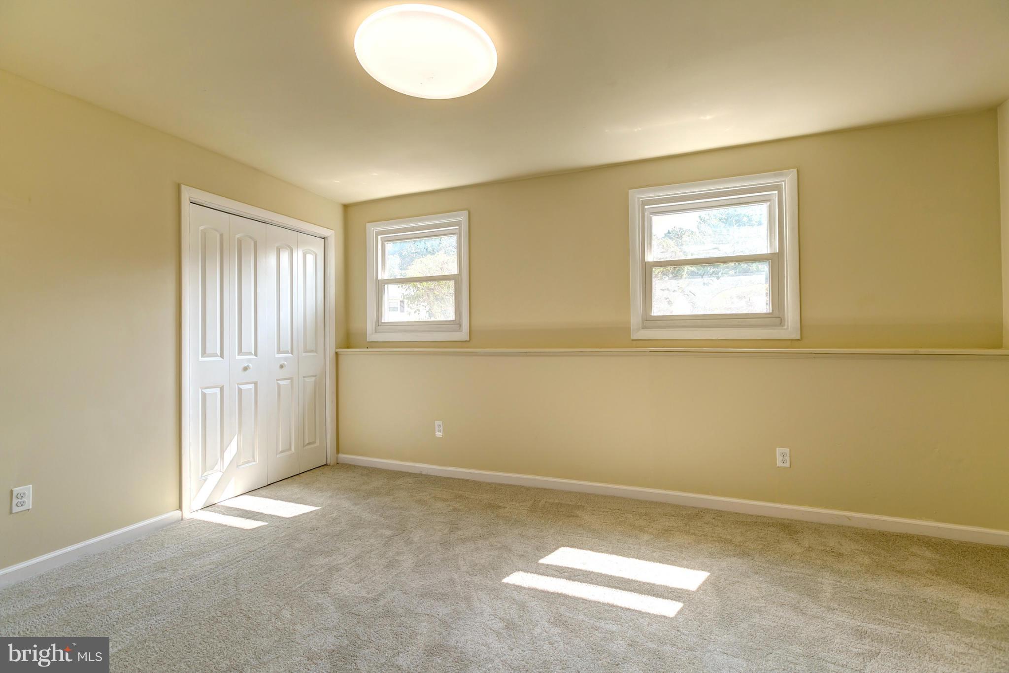 6711 Fox Meadow Road Baltimore, MD 21207 - Photo 22 of 30 an empty room with windows