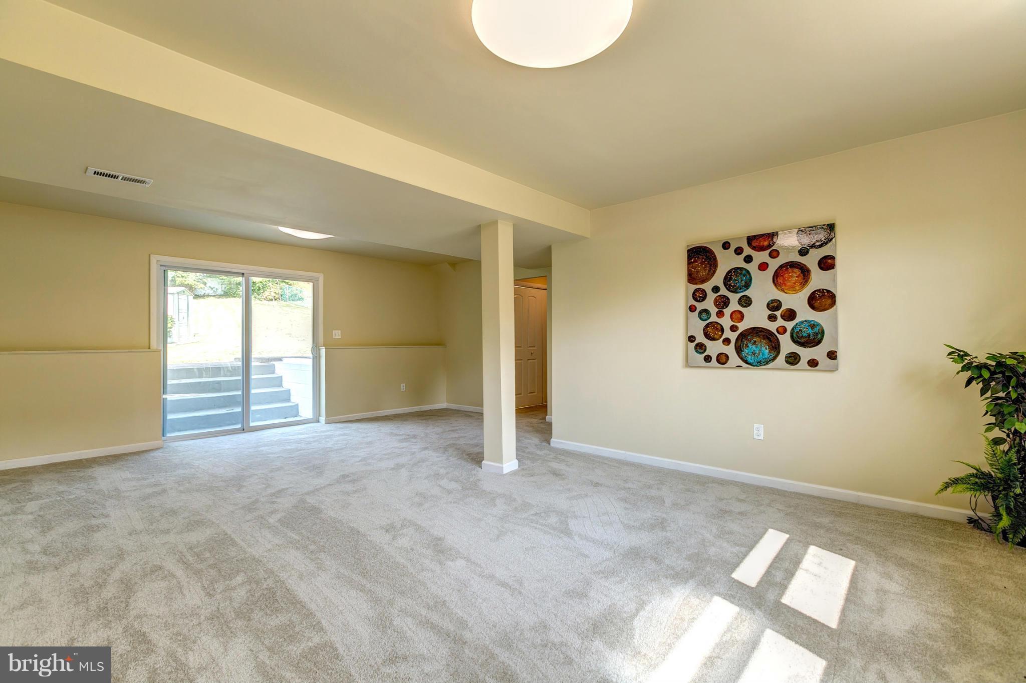 6711 Fox Meadow Road Baltimore, MD 21207 - Photo 23 of 30 a view of an empty room with a window