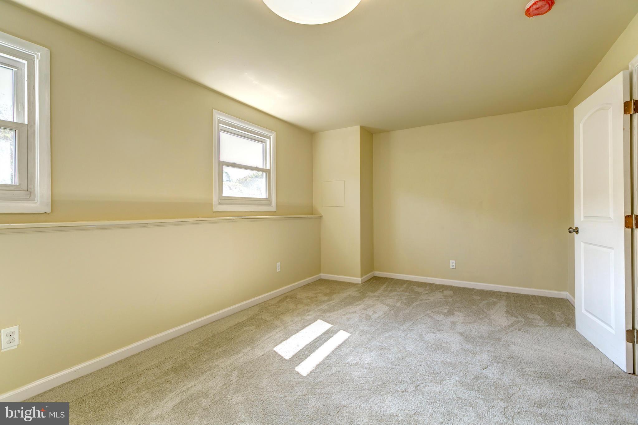 6711 Fox Meadow Road Baltimore, MD 21207 - Photo 24 of 30 an empty room with windows
