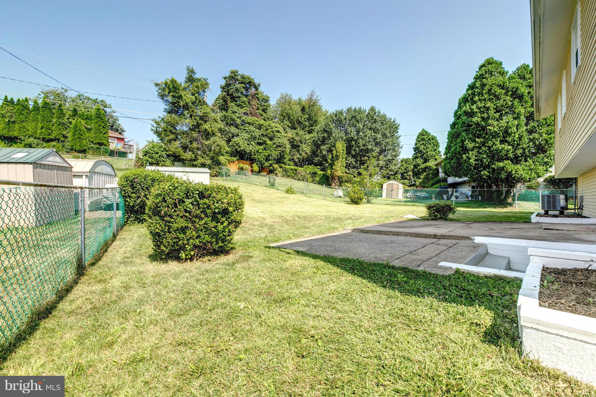 6711 Fox Meadow Road Baltimore, MD 21207 - Photo 26 of 30 a view of yard with tree in the background