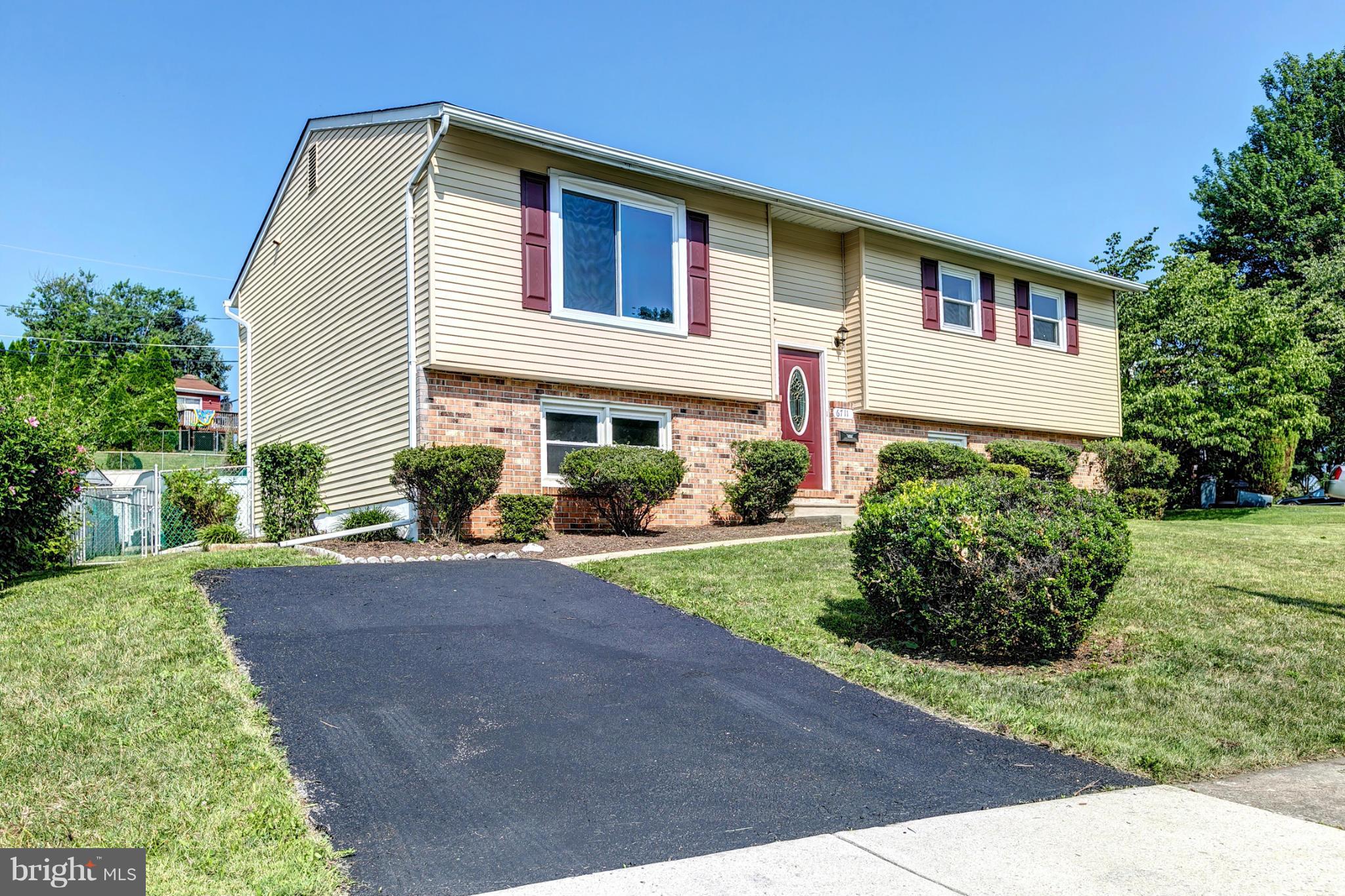 6711 Fox Meadow Road Baltimore, MD 21207 - Photo 29 of 30 a front view of a house with a yard