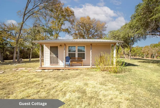 a living room with couch and a wooden floor