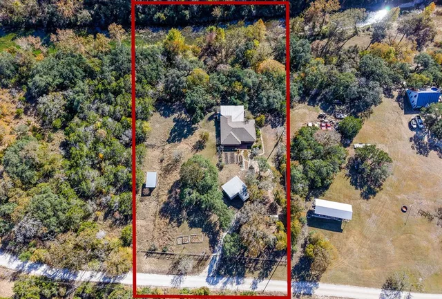 an aerial view of residential building and lake