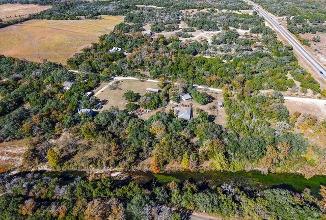 a picture of a bench in front of a bird