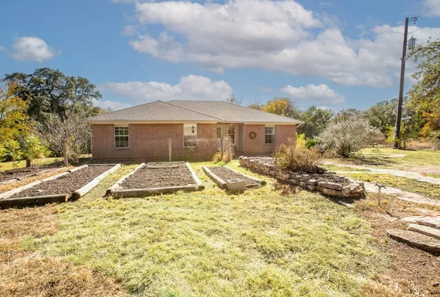 a living room with furniture cabinets and a window