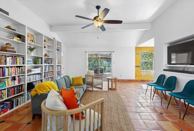a living room with furniture and a window