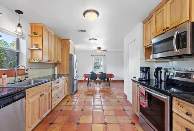 a bedroom with a bed and a table in it