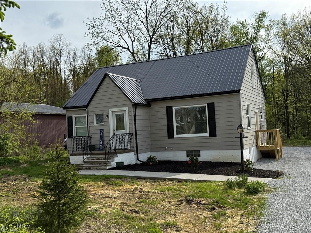 1644 Canton Road Akron, OH 44312 - Photo 4 of 25 View of front facade featuring metal roof