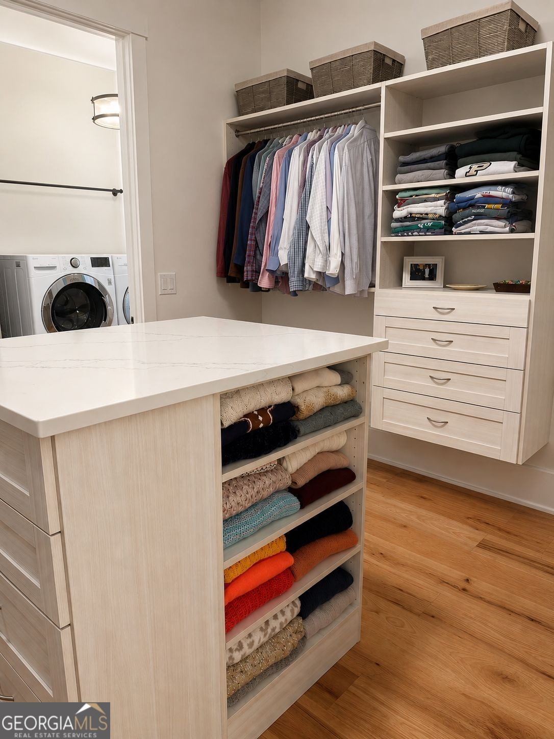913 Indigo Bunting Road Statham, GA 30666 - Photo 17 of 31 a view of walk in closet with clothes and shoes