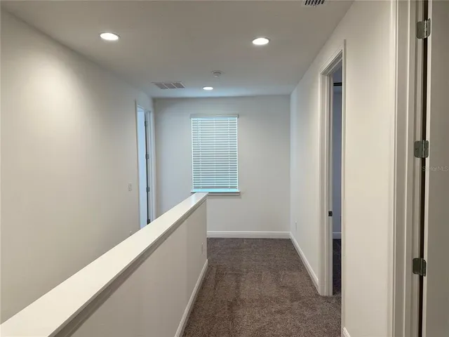 a view of hallway with stairs