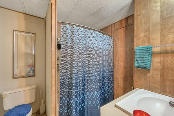 a bathroom with a sink vanity and a mirror