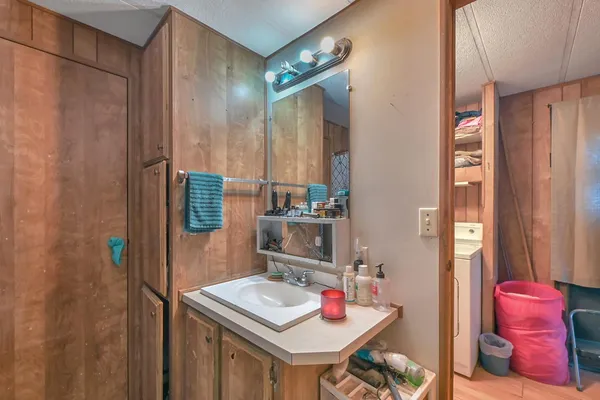 a bedroom with a bed and dresser