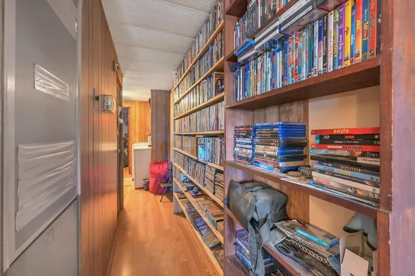 a reading room with furniture and book shelf
