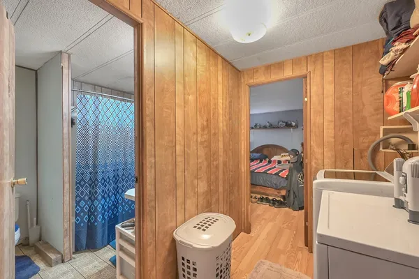 a bathroom with a shower curtain and a sink