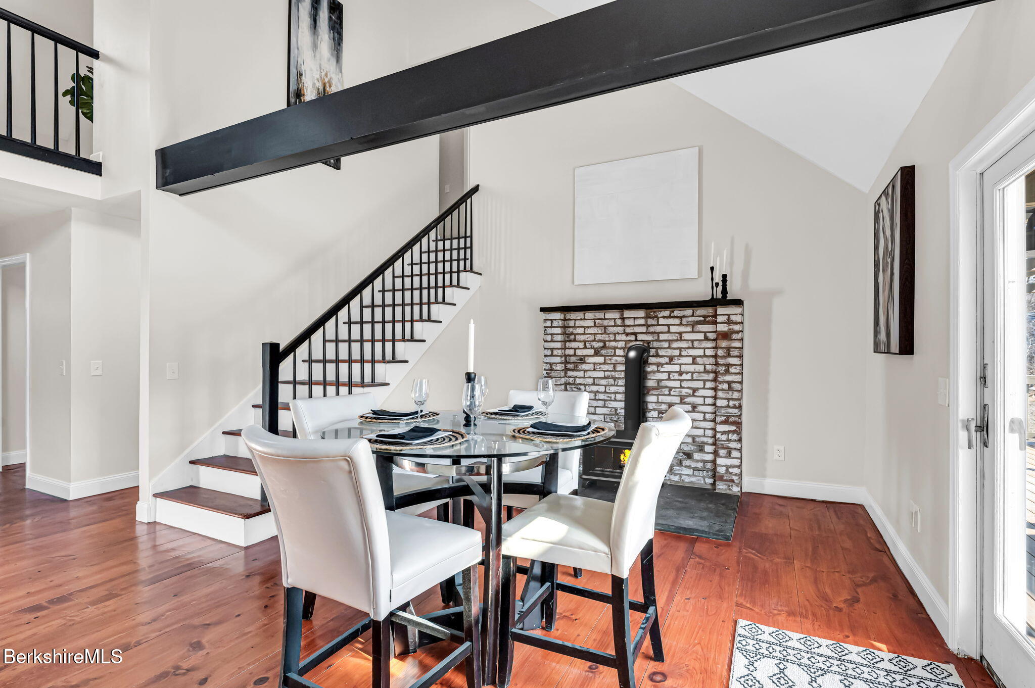 11 E Road Richmond, MA 01254 - Photo 22 of 65 a view of a dining room with furniture and wooden floor
