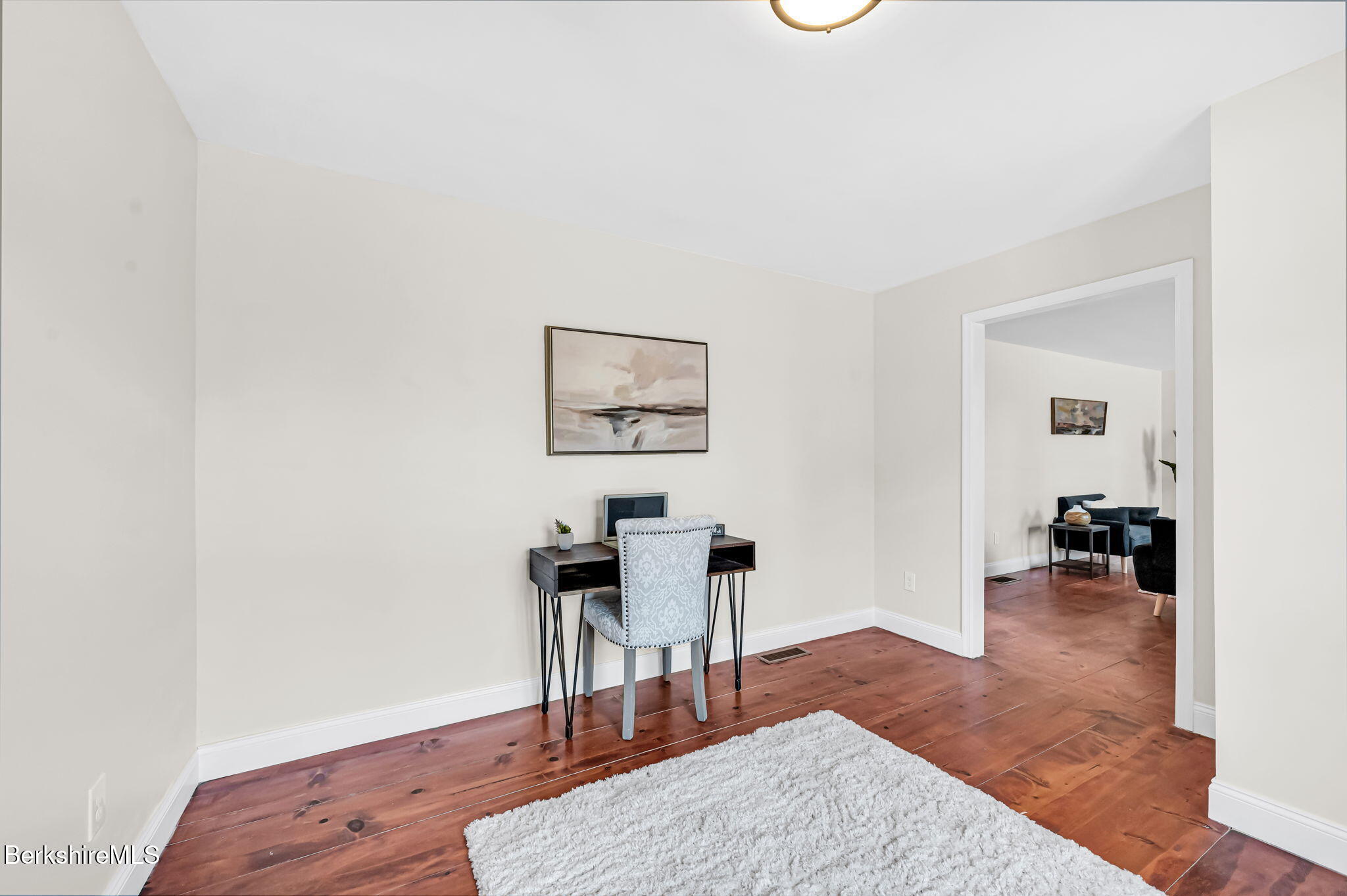 11 E Road Richmond, MA 01254 - Photo 25 of 65 a living room with furniture and a wooden floor