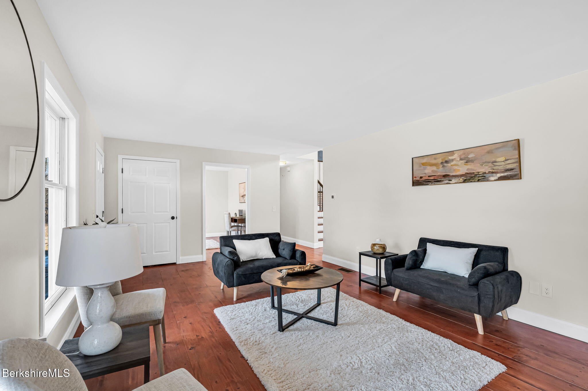 11 E Road Richmond, MA 01254 - Photo 29 of 65 a living room with furniture a rug and a lamp