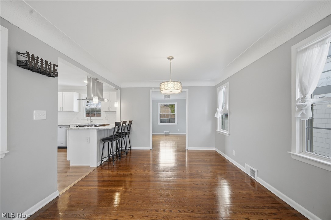 3722 Lindholm Road Shaker Heights, OH 44120 - Photo 11 of 34 This interior features hardwood flooring, a contemporary chandelier, and a bright, neutral color palette