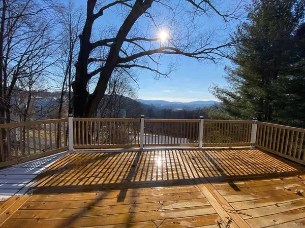 a view of balcony with wooden floor