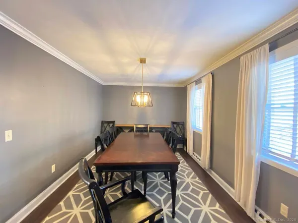a view of a dining room with furniture and window
