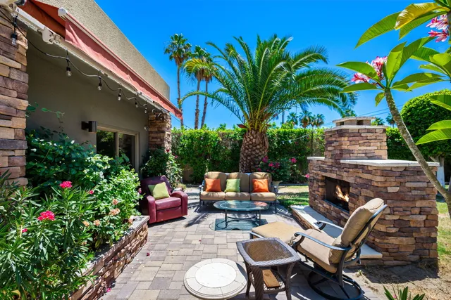 a view of a chairs and table in the patio