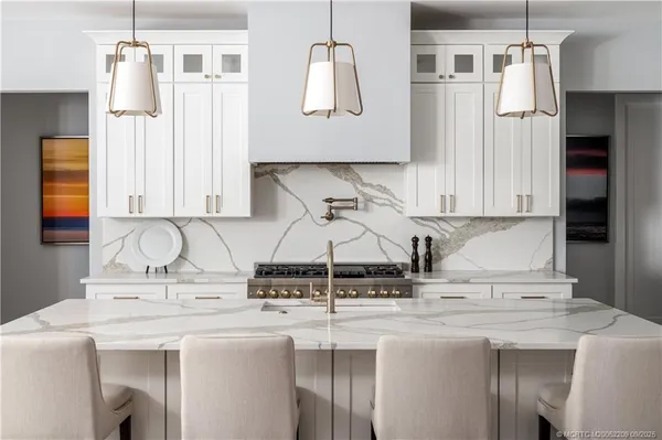 a kitchen with stainless steel appliances granite countertop a sink and a cabinets