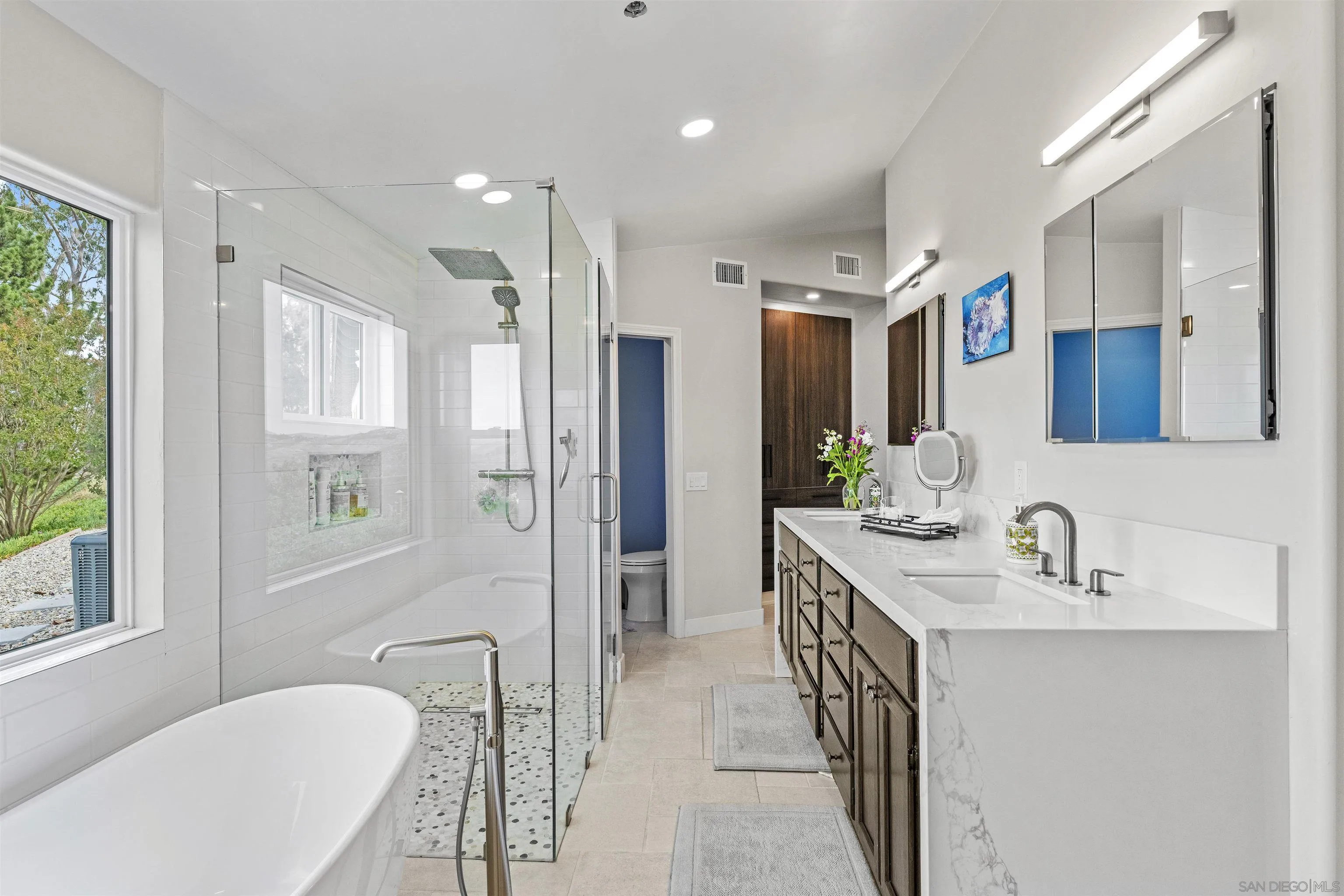 30659 Diaz Road Valley Center, CA 92082 - Photo 26 of 44 a bathroom with a tub sink and mirror