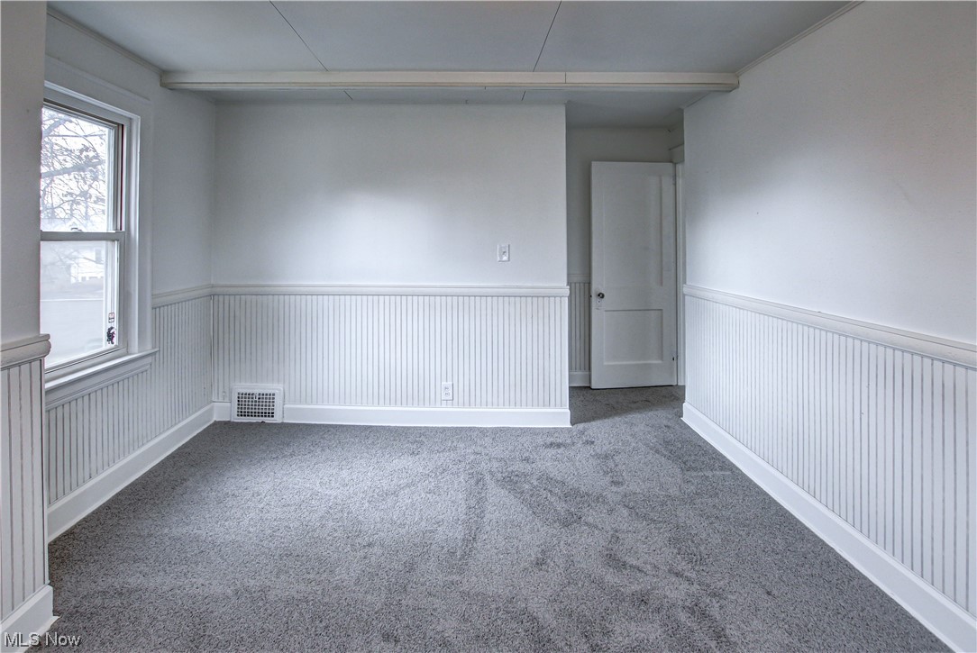 4764 Rockwood Road Cleveland, OH 44125 - Photo 17 of 35 Spare room with carpet flooring