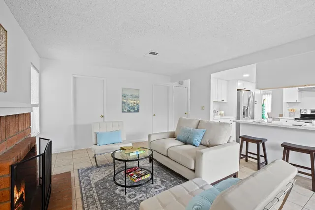 a living room with furniture and a table