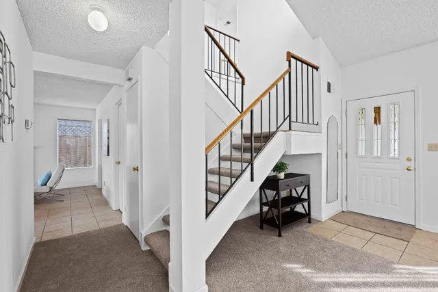 a view of front door with dining room and stairs