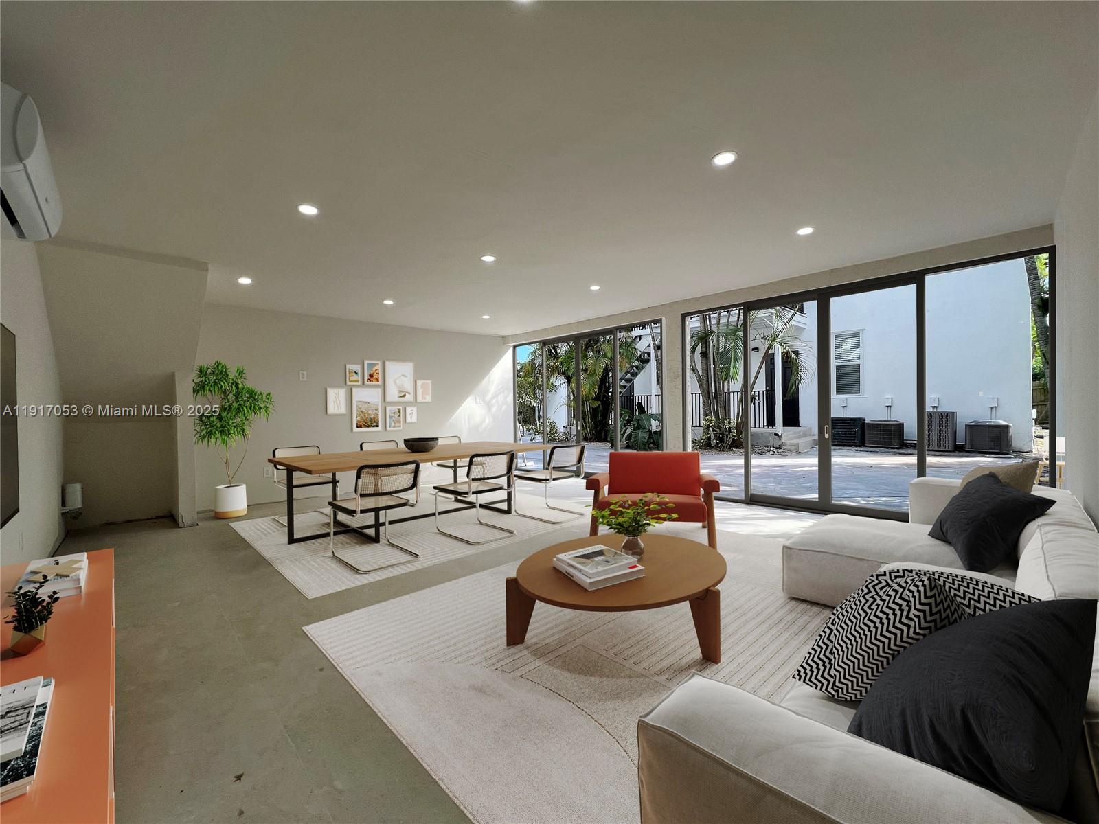 893 Northeast 81st Street, Unit 2 Miami, FL 33138 - Photo 7 of 7 a living room with furniture and a large window