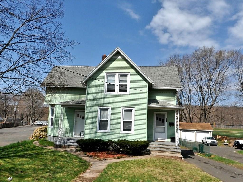 831 Hanover Road Meriden, CT 06451 - Photo 1 of 1 a front view of a house with a yard