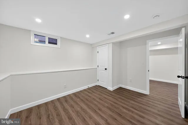 a view of room with wooden floor