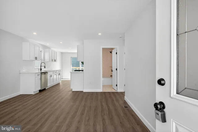 a view of a kitchen with wooden floor