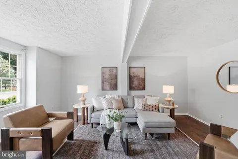 a kitchen with stainless steel appliances granite countertop a refrigerator a stove a sink and a microwave