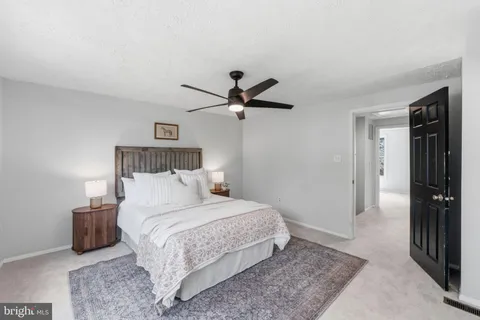 a bedroom with a bed and a closet