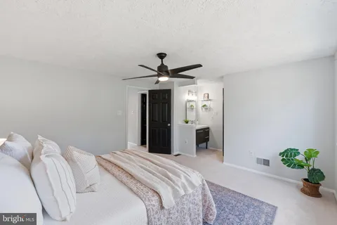 a bathroom with a sink toilet and a mirror