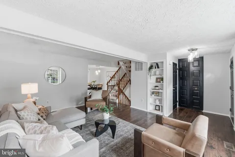a living room with furniture and a table