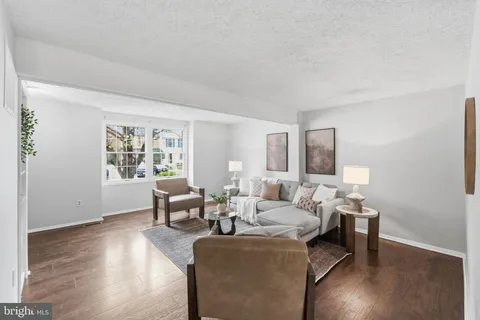 a kitchen with stainless steel appliances granite countertop a stove a refrigerator and a sink