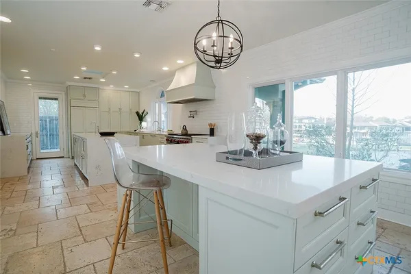 a kitchen with cabinets and appliances