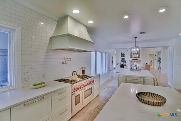 a bathroom with a double vanity sink and shower
