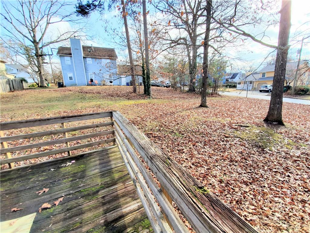 524 Julius Drive Stone Mountain, GA 30087 - Photo 17 of 17 a view of a yard with wooden fence