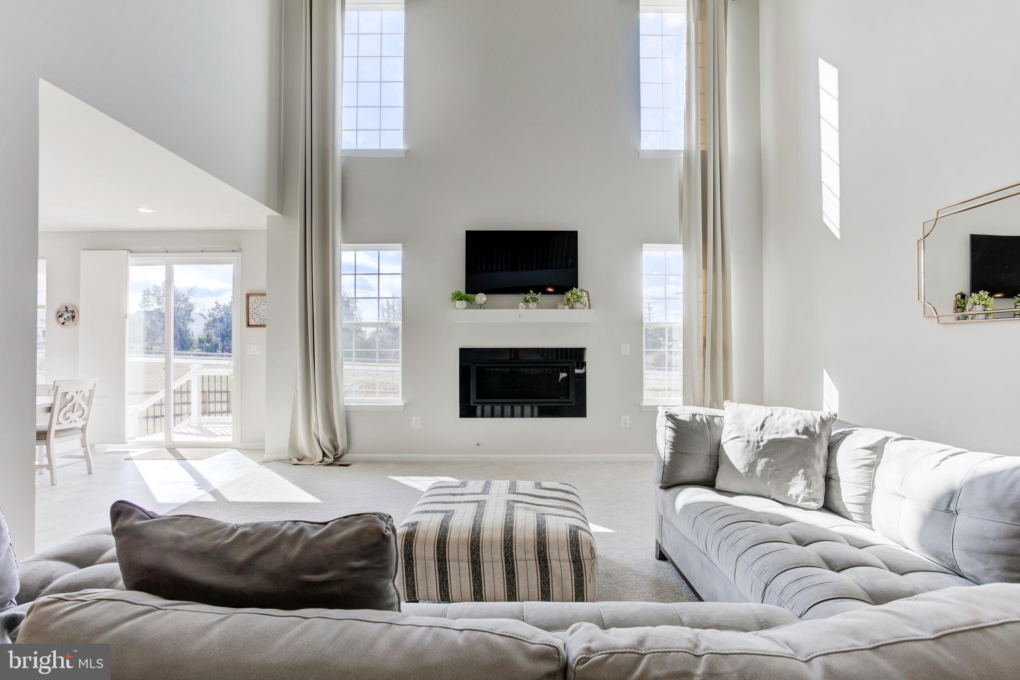 13402 Maymount Drive Culpeper, VA 22701 - Photo 12 of 25 a living room with a couch and a flat screen tv