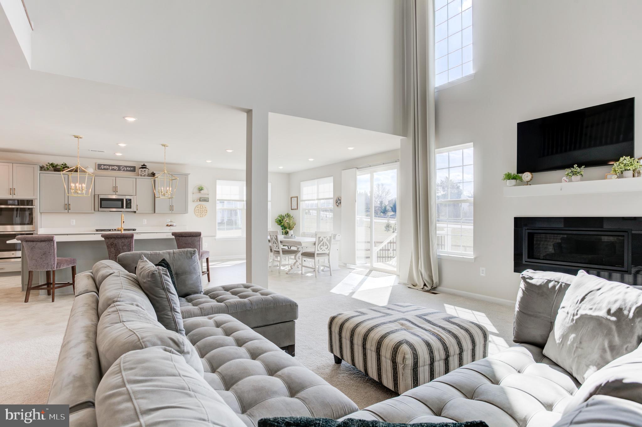 13402 Maymount Drive Culpeper, VA 22701 - Photo 13 of 25 a living room with furniture and a flat screen tv