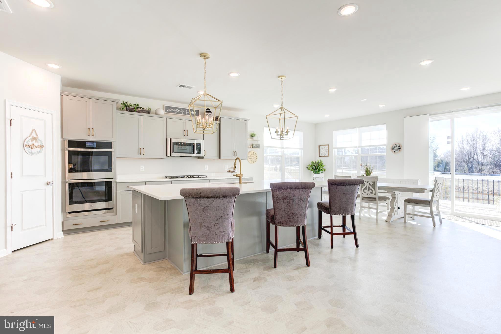 13402 Maymount Drive Culpeper, VA 22701 - Photo 14 of 25 a large kitchen with a table and chairs