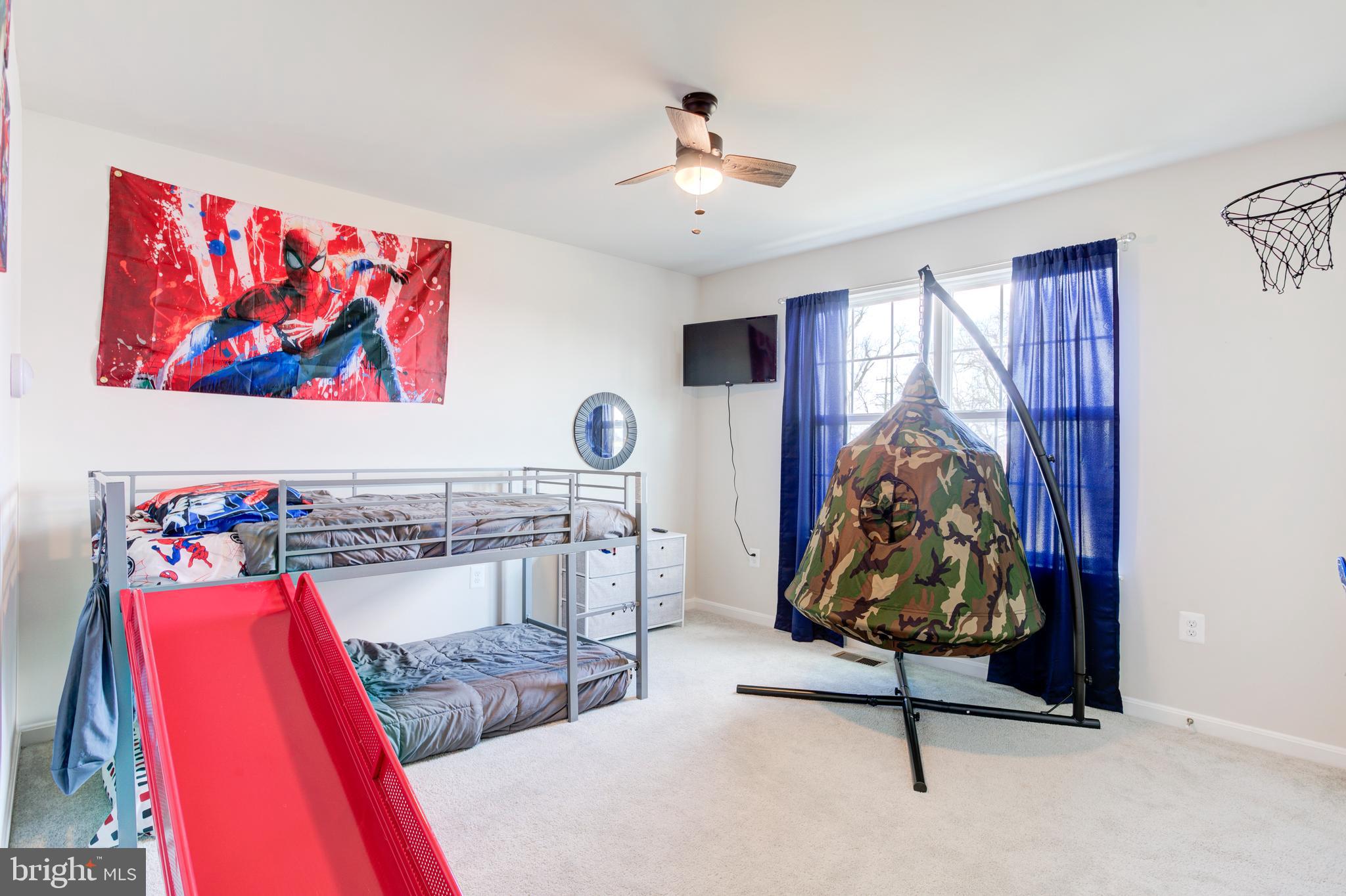 13402 Maymount Drive Culpeper, VA 22701 - Photo 20 of 25 a living room with furniture and a chandelier