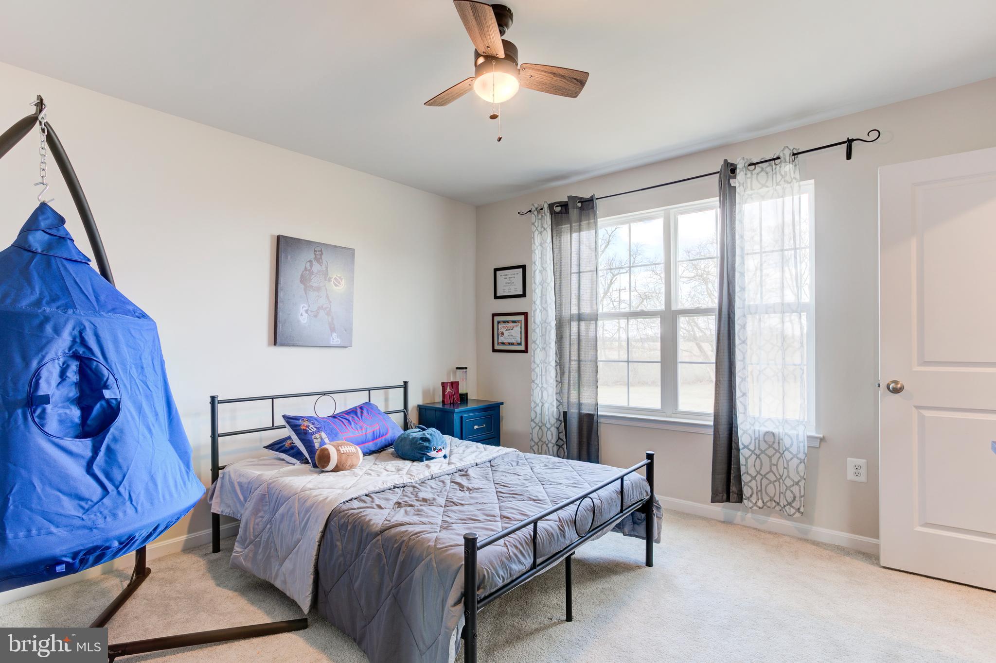 13402 Maymount Drive Culpeper, VA 22701 - Photo 22 of 25 a bedroom with a bed and a window