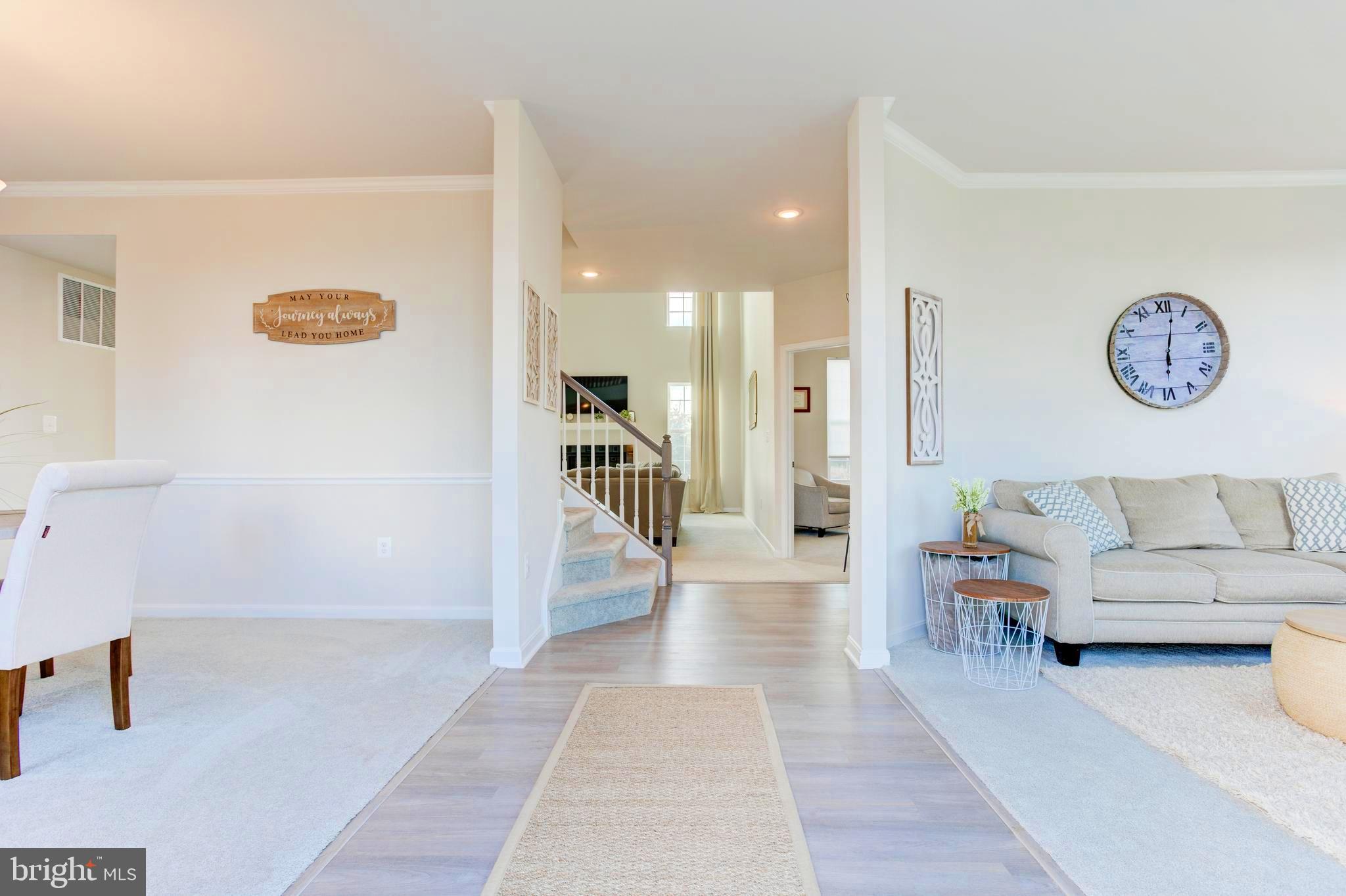 13402 Maymount Drive Culpeper, VA 22701 - Photo 7 of 25 a view of a hallway with a couch