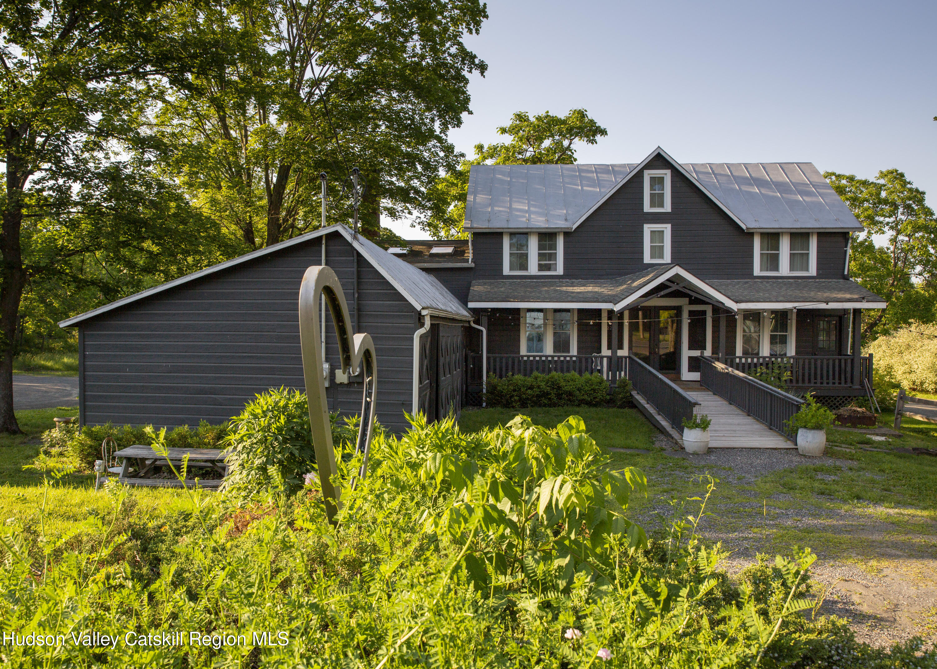 222 Main Street Germantown, NY 12526 - Photo 1 of 36 a front view of a house with swimming pool