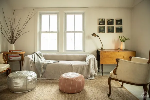 a bedroom with two beds and a window